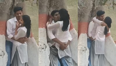 College couple enjoys outdoor sex below a big tree